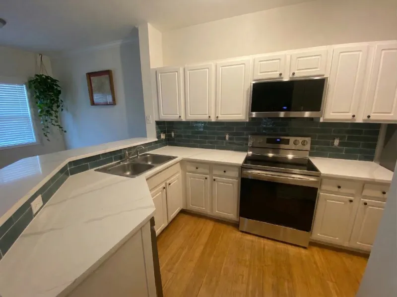 Kitchen with new tile backsplash installed by Paez And More
